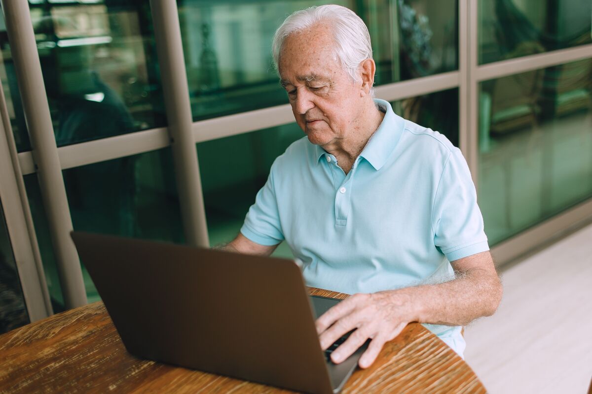 man using a laptop, dwp pension new bank rules september 2025 rumours explained
