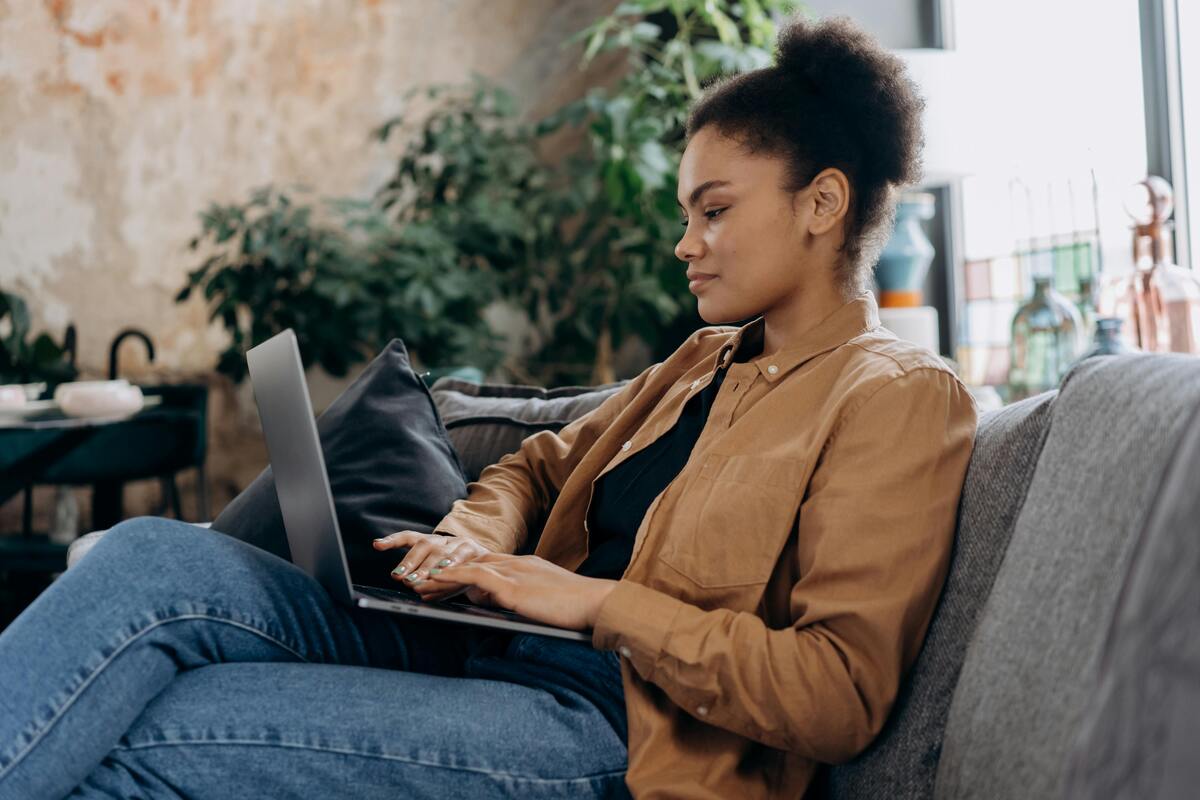 woman typing on laptop, how is corporation tax calculated