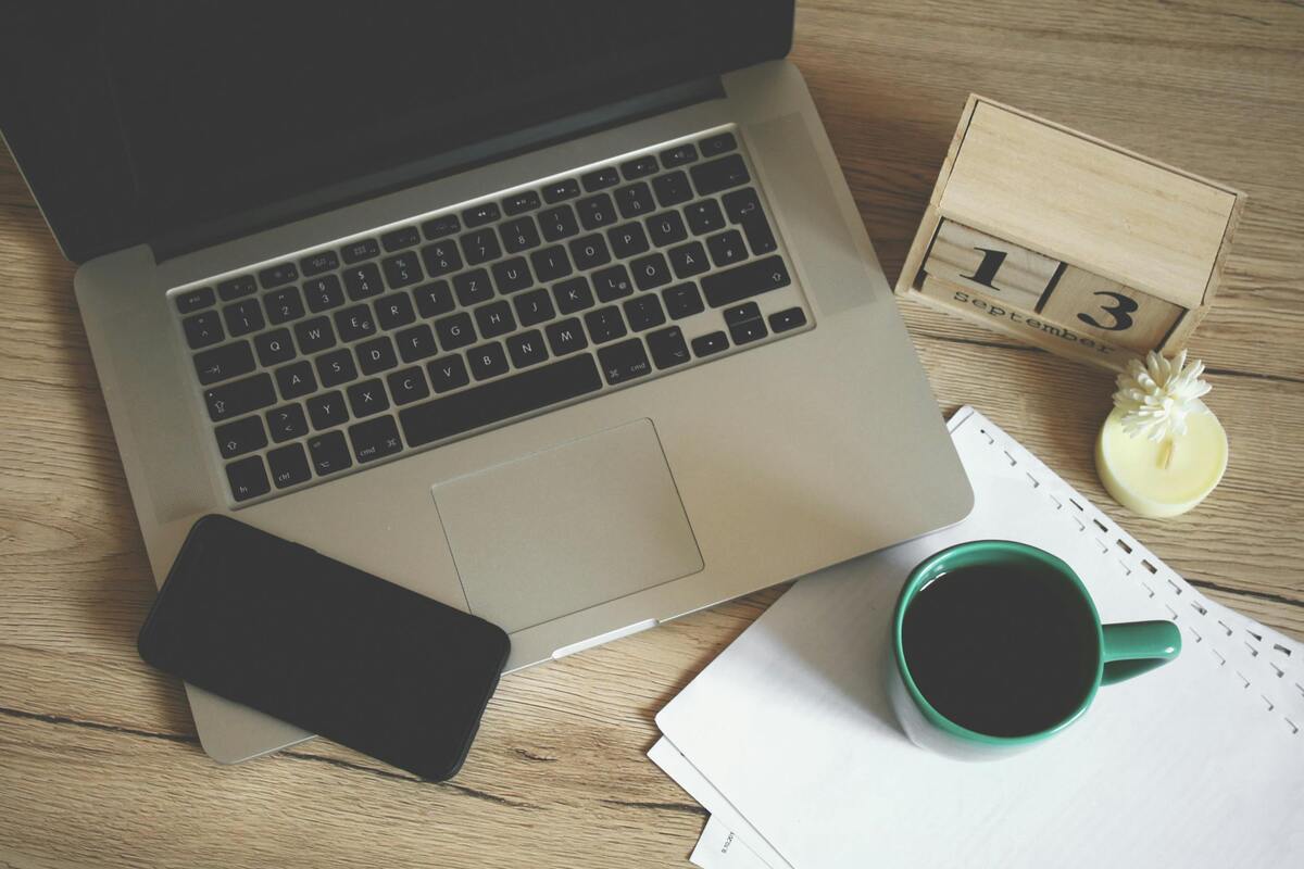 laptop, mobile coffee cup, calendar - overpayment relief claim