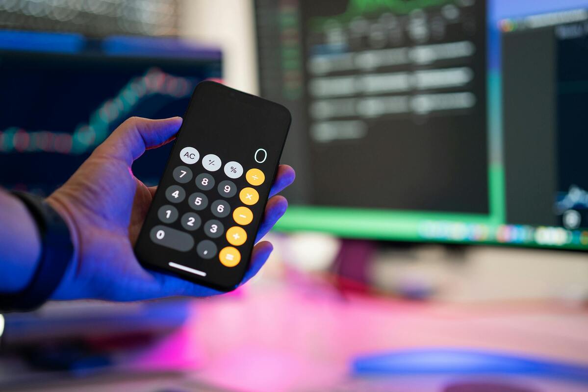 hand holding phone caculator with zero on it, zero rated VAT